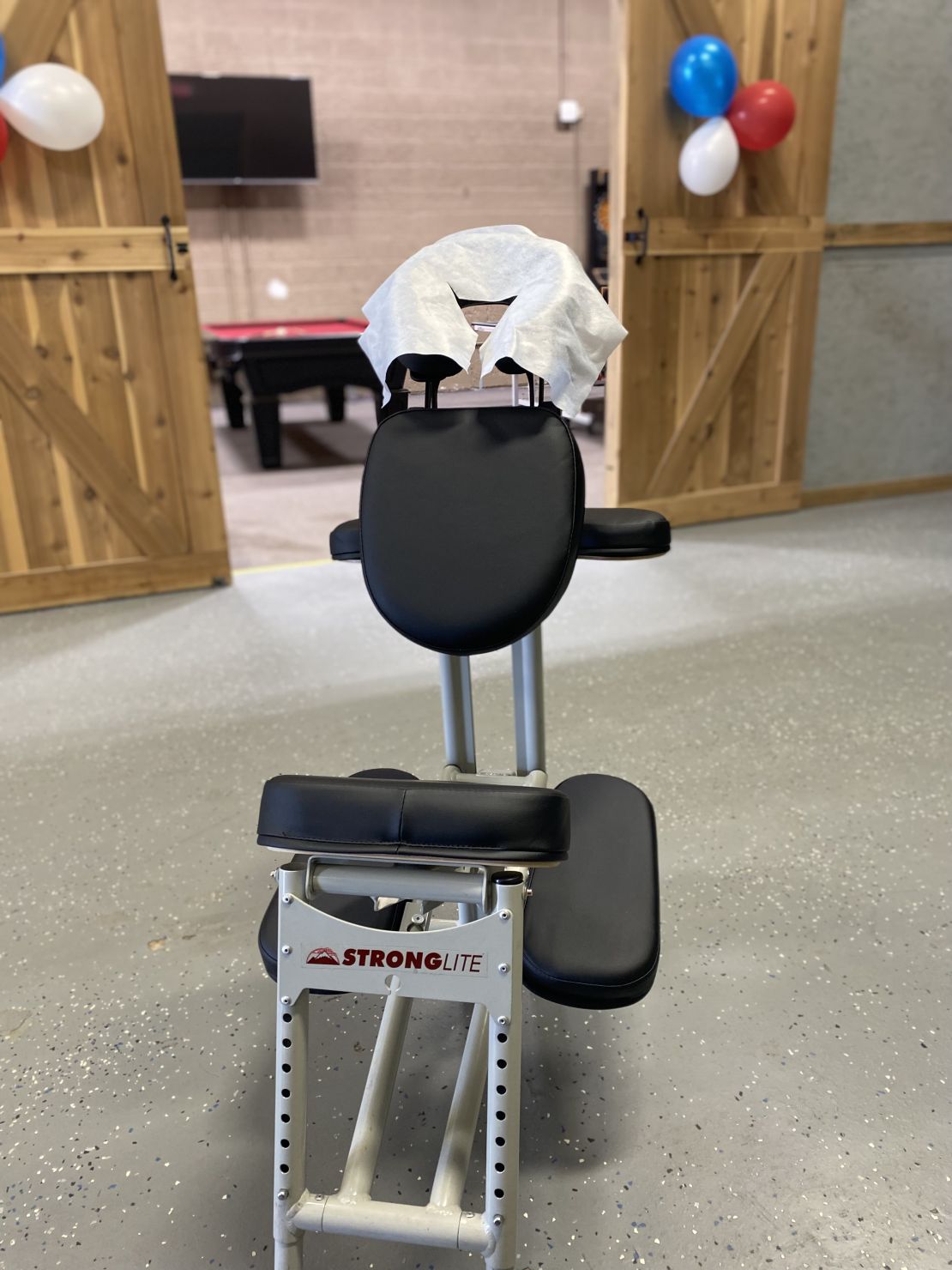 A Stronglite massage chair set for a celebration.